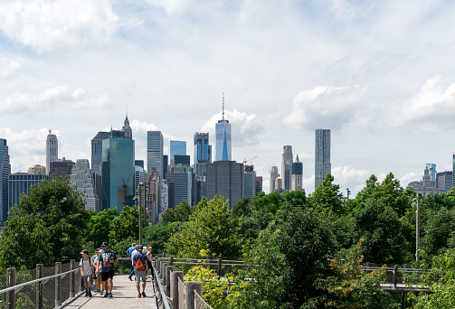 Brooklyn, New York, USA - July 8, 2017: View on Manhattan downtown from Squibb park bridge in Brooklyn Bridge park, New York