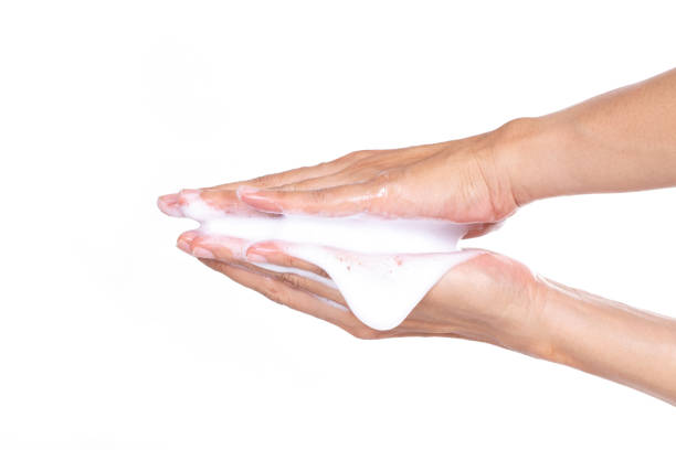 istock foam cream sample on hand, isolated on white background 1010386180