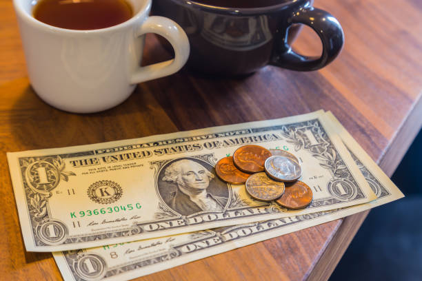 istock Money tip or payment in coffe e shop. 1010391998