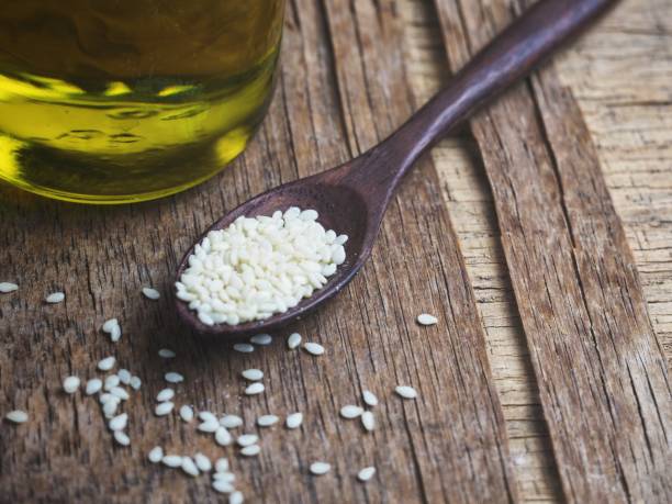 istock Sesame oil on wood background 1010397506