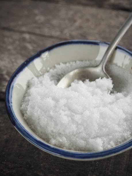 istock Salt on spoon and wood background 1010398288