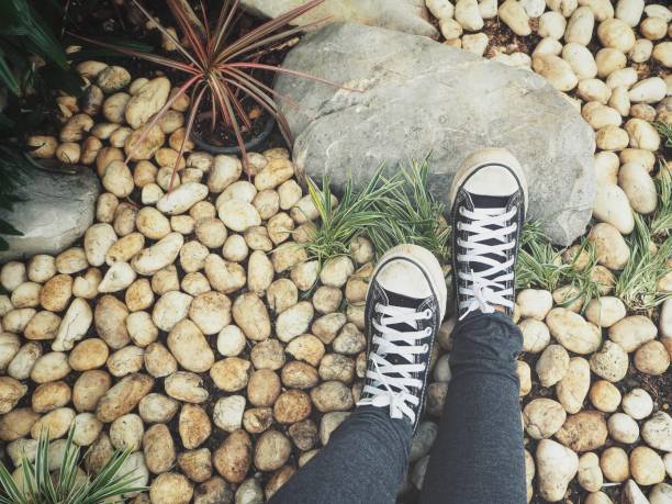 Selfie of sneakers with stone
