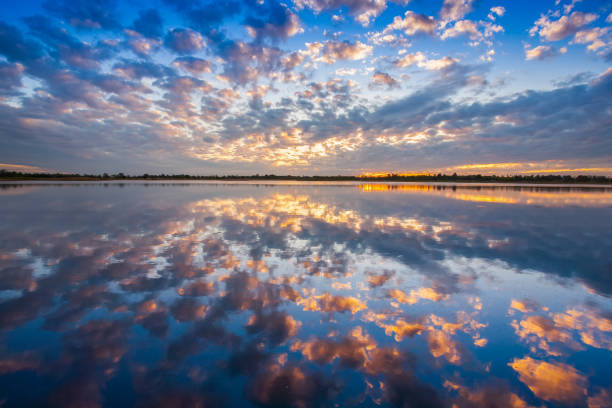istock A colorful pattern of cloudy on sky is reflecting on water 1010413220