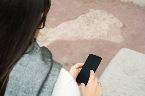 istock Young latin women sending message with smartphone. 1010413456