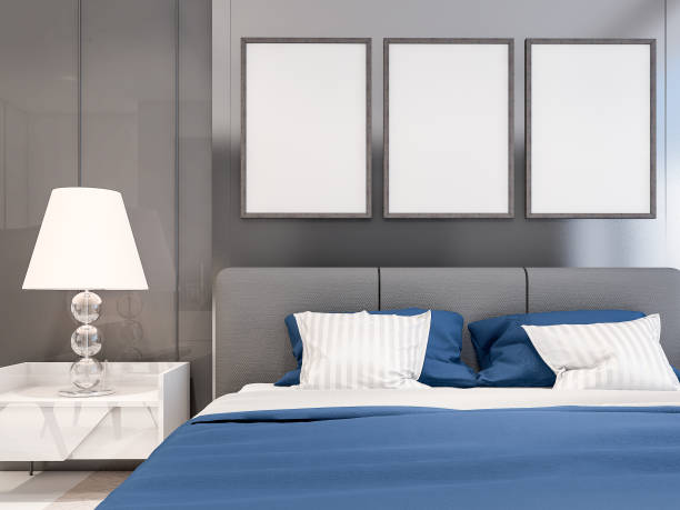 istock Interior poster mock up with three vertical frames on the wall in master bedroom interior. 3D rendering 1010430710