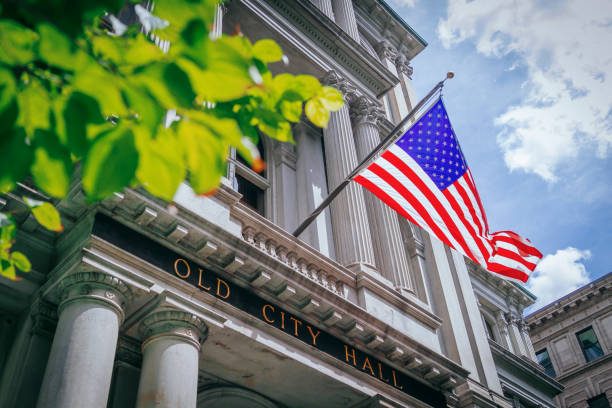 US Flag and the Old City Hall of Boston, USA stock photo