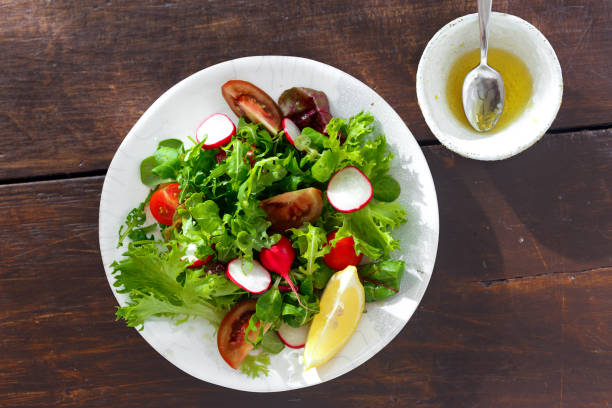 istock Plate fresh vegetable salad with sauce 1010436050