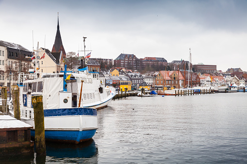 Pleasure boats moored in winter port of Flensburg, Germany