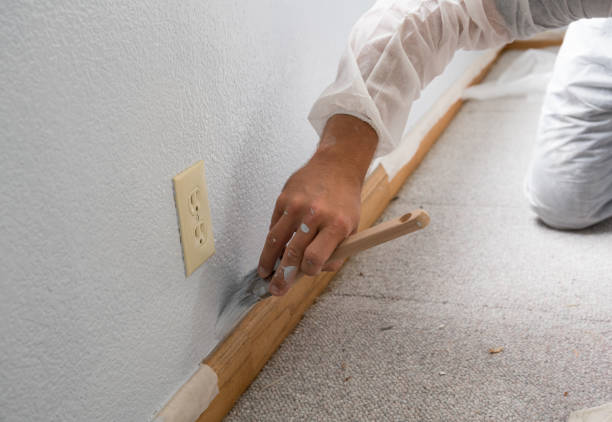 istock Man painting interior wall of home 1010448542