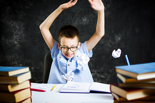 Threw Homework Schoolboy Throwing Out Failed Homework Solutions Stock Photo - Download ...