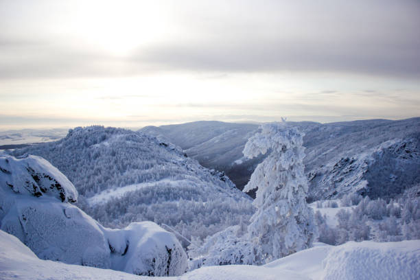 istock Winter landscape, snowy Ural mountains in cloudy day, Russia 1010449028