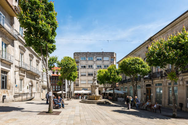 Vigo, Spain - May 20, 2017: People rest on the square Praza da Princesa in the city of Vigo in Galicia, Spain.