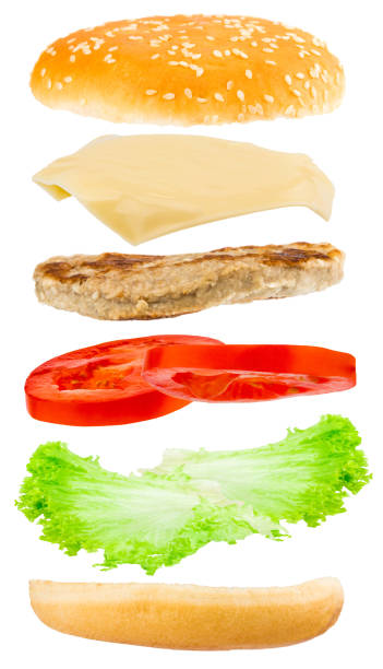 Delicious hamburger with flying ingredients on white background stock photo