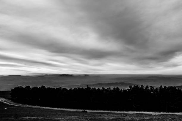 istock Subasio Mt. (Umbria, Italy), with sky covered by clouds and mist on the valley underneath 1010477344