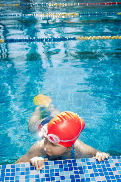 istock Young girl learning to swim in the pool 1010482490
