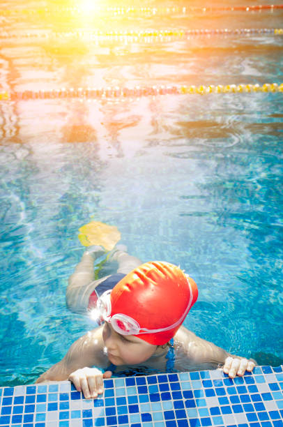 istock Young girl learning to swim in the pool 1010482504