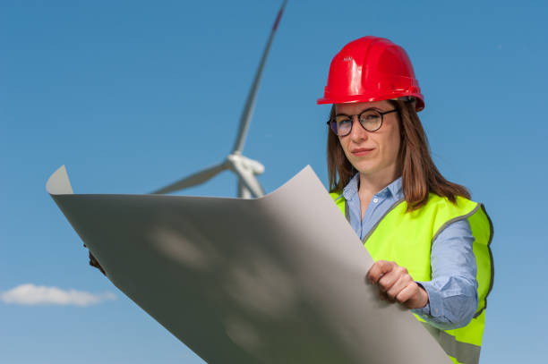 istock Concept of engineers and windmills 1010482514