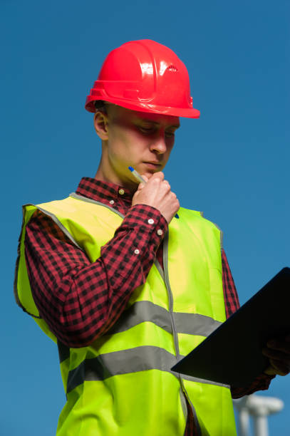 istock Concept of engineers and windmills 1010482576