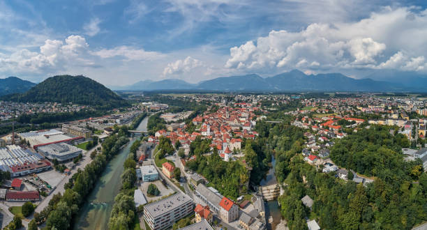 Panorama view of Kranj, Slovenia, Europe Kranj in Slovenia with St. Cantianus Church in the foreground and the Kamnik Alps behind krvavec stock pictures, royalty-free photos & images