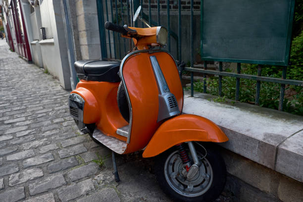 istock Red Vespa parked on a street 1010491914