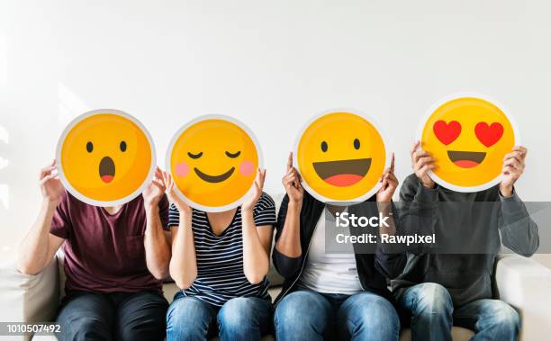 Diverse People Holding Emoticon Stock Photo - Download Image Now - Emoticon, Social Media, Happiness