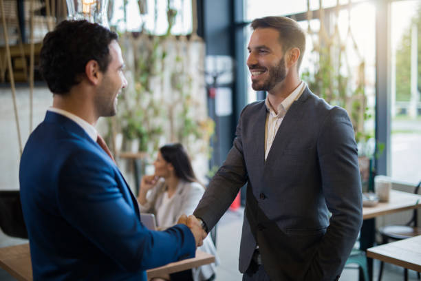 istock Two businessmen shaking hands after job well done 1010507550