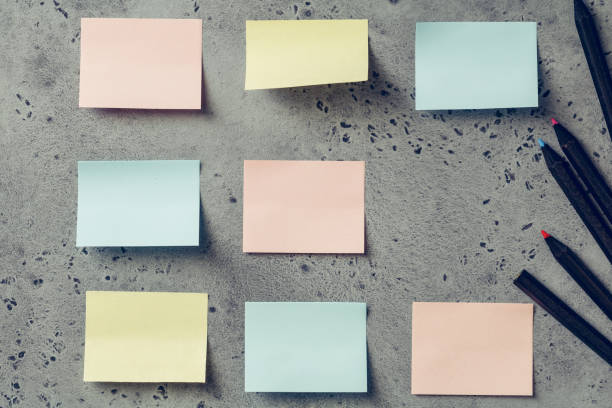 istock Colorful empty sticky notes on a grey textured background. The concept organization and planning. 1010507682