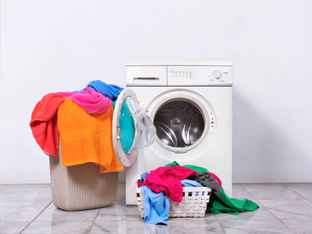 istock Laundry basket and washing machine at home 1010507988