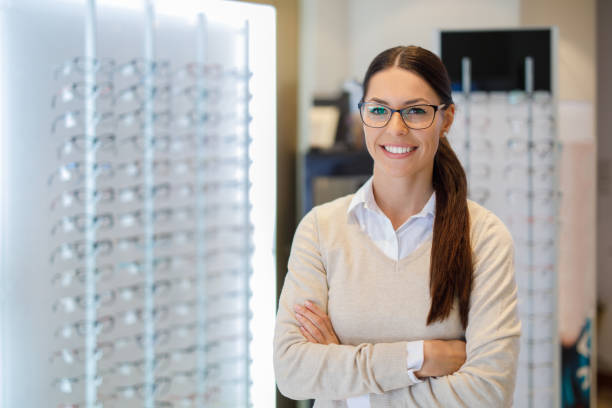 istock Woman wearing eyeglasses at the optical store 1010510576