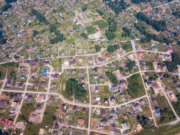 istock Helicopter drone shot forest, city and road 1010511250