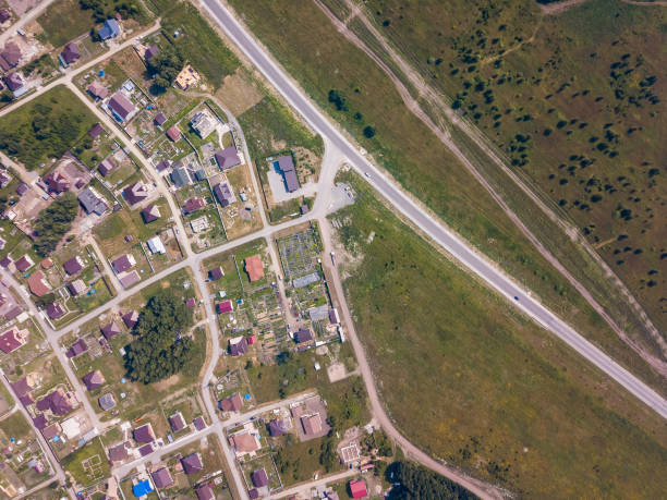 istock Helicopter drone shot forest, city and road 1010513880