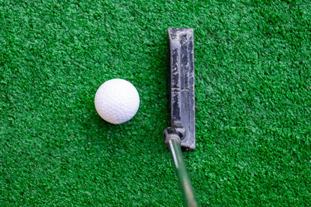 istock Golfer preparing on training putt with golf ball 1010514480
