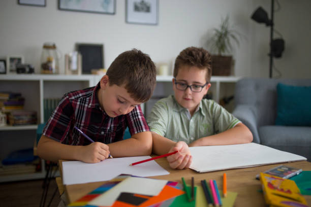 istock Little brothers enjoying drawing together 1010514510