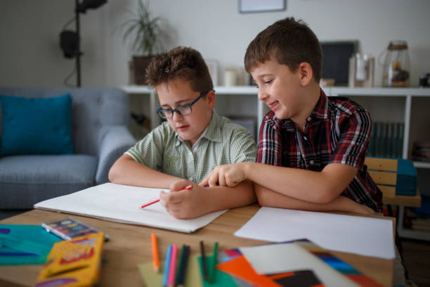 istock Little brothers enjoying drawing together 1010514888