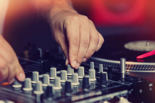 istock Hand of dj playing music on party 1010518758