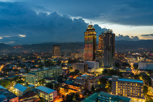 Cebu Ramos area by twilight city buildings houses and lights from the city Cebu, Philippines - June 14, 2018: Cebu wide angle view showing city buildings houses and lights from the city  in the Ramos area with nobody visible cebu province stock pictures, royalty-free photos & images