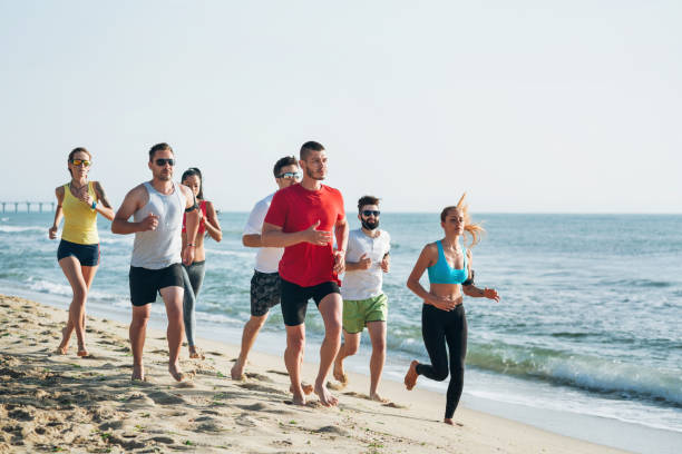 istock Young people jogging at the seashore 1010525332