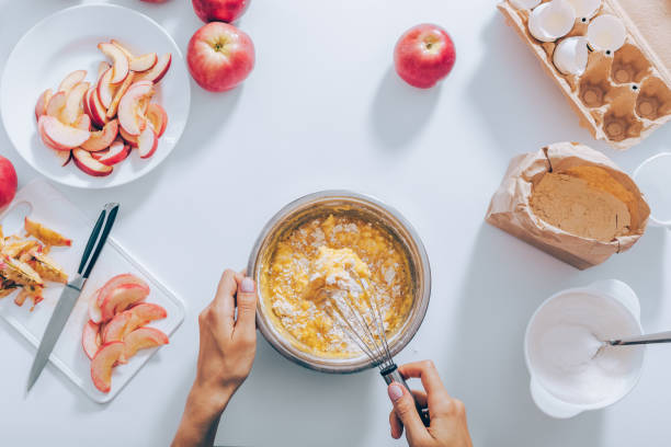 istock Top view female's hands mixing flour, eggs and sugar 1010526678