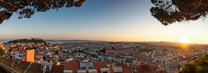sunset view on river and historic Lisbon from Miradouro da Senhora do Monte