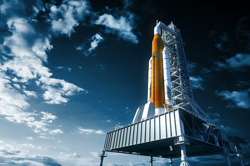 Space Launch System On Launchpad Over Background Of Sky. 3D Illustration. NASA Images Not Used.