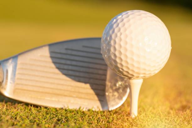istock golf ball on lip of cup 1010550432