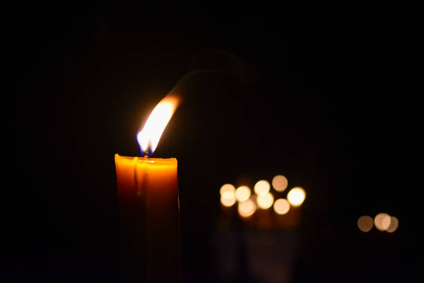 istock Candles Burning at Night and bokeh background 1010555944