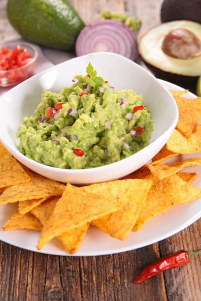 istock tortilla chip and guacamole 1010565276