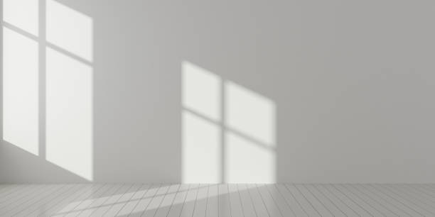 istock Stimulate scene of white empty room with sun light cast shadow on the laminate wood wall and plank floor,Perspective of minimal architecture. 3D rendering 1010576478