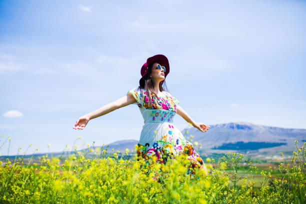 istock a young woman in the spring 1010579406