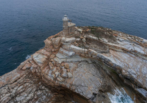 istock Old stone lighthouse on rocky island Scoglietto. 1010580436