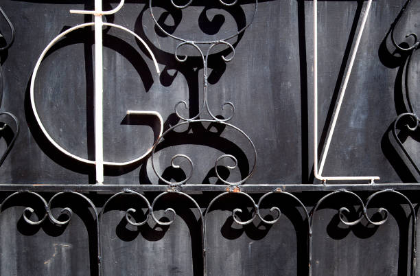 istock wrought iron door with letters and painted black 1010580556