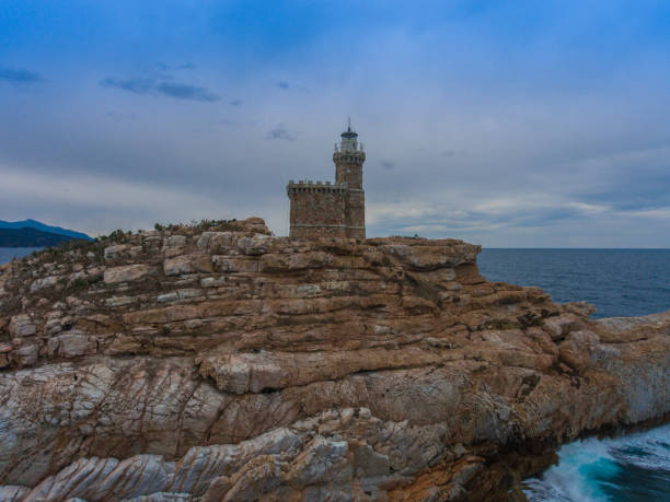 istock Ancient lighthouse on a rock in the sea. 1010586226