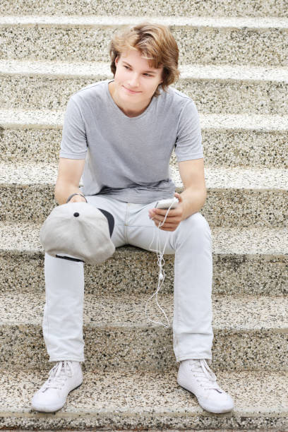 istock Using smart phone.Teenage boy typing text message. 1010586318