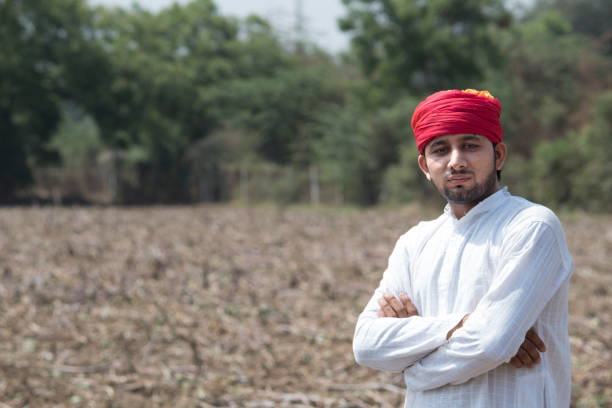 istock Farmer with arms crossed in field 1010586702
